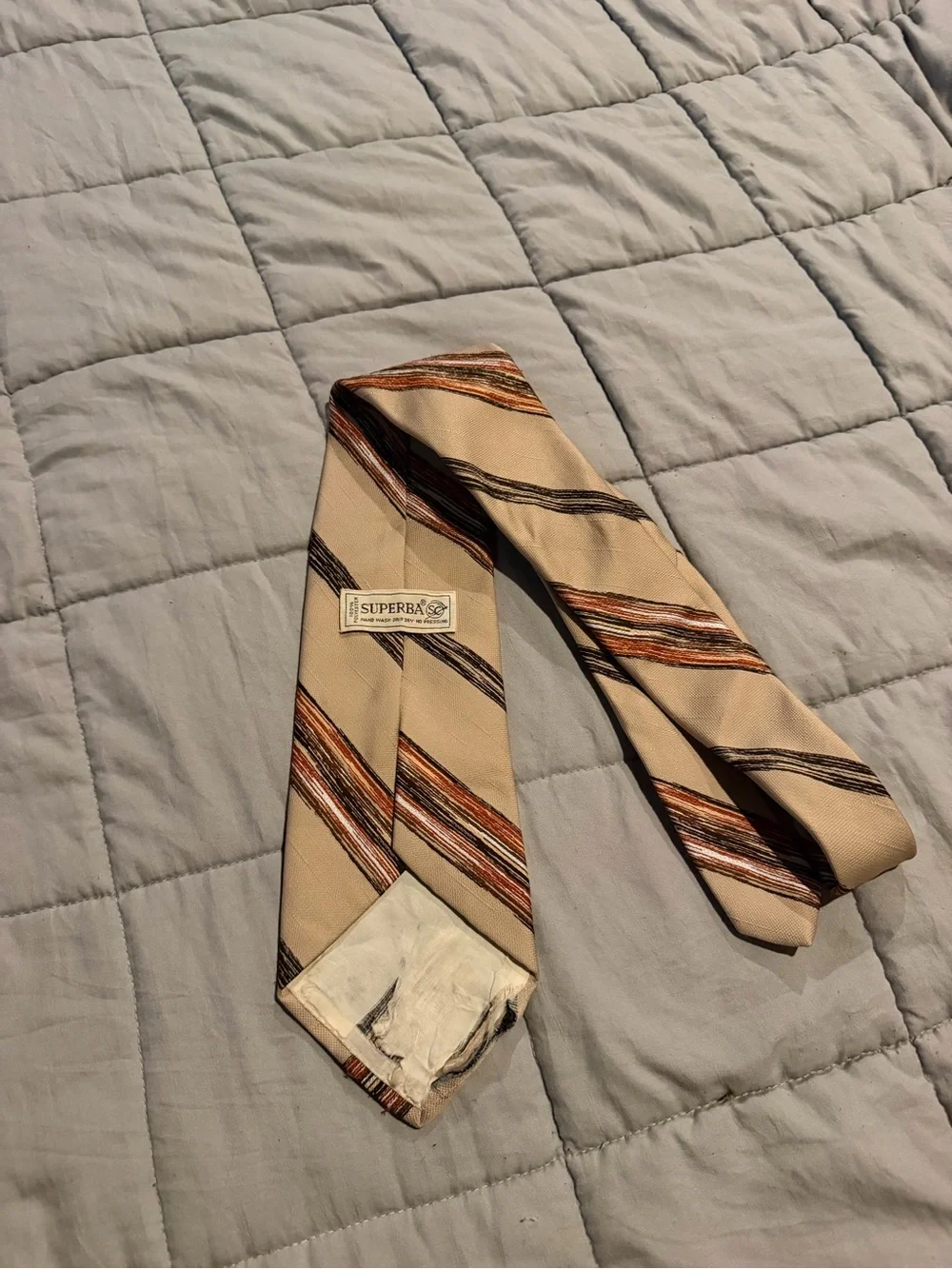 Beige Men's Striped Necktie with Orange and Brown Accents